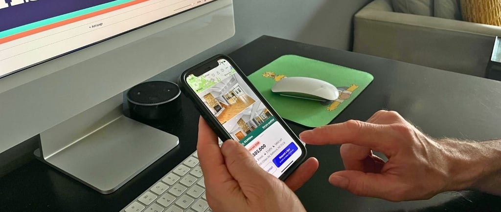 image of someone about to push the blue button on Zillow