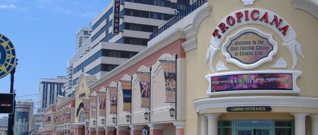 a city street scene with a clock tower in the background