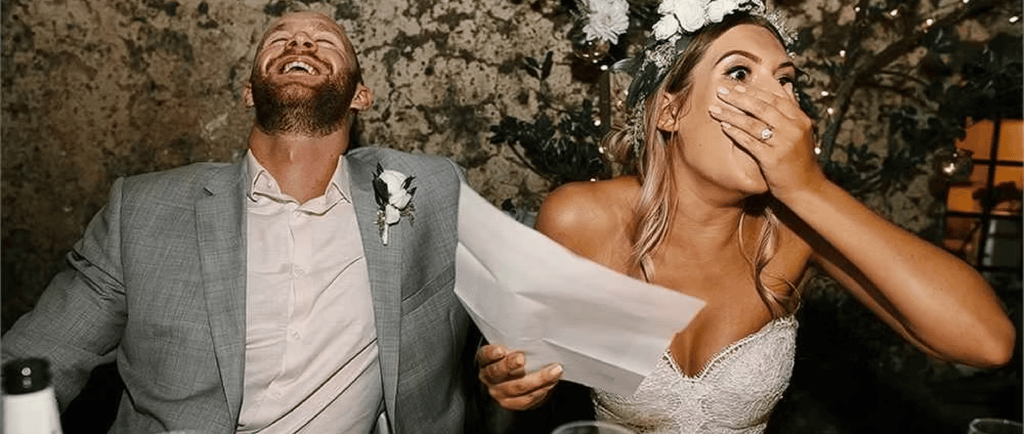a man and woman are laughing and laughing