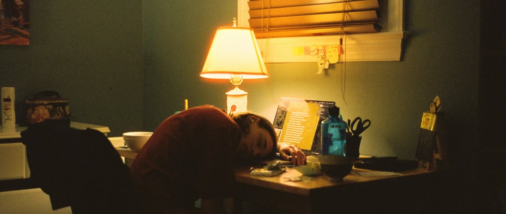 Disengaged employee asleep at their desk representing job hugging 