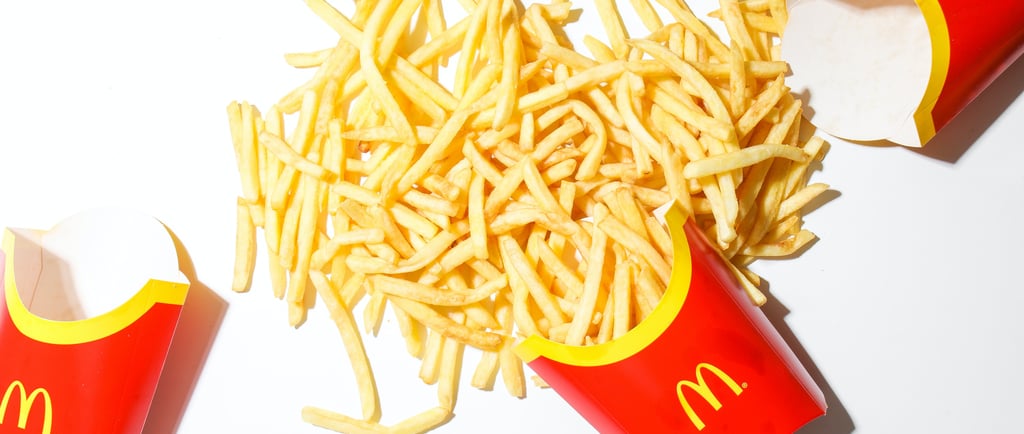 a pile of fries on a table with fries and fries