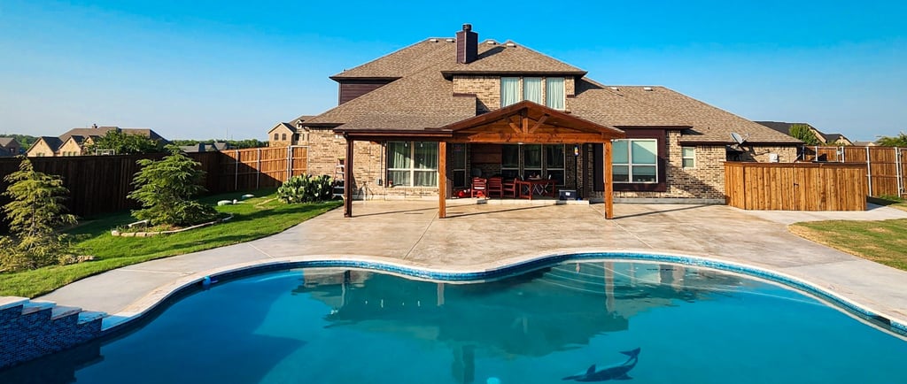Finished rectangular backyard pool in Forney Texas with a sun shelf, clean coping, and simple concrete decking