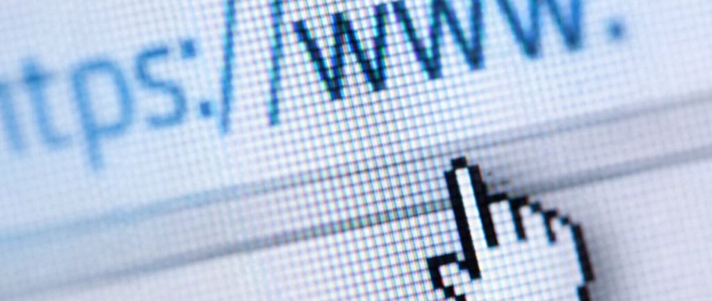 Online job search with cursor hovering over a secure https website URL address on a computer screen.