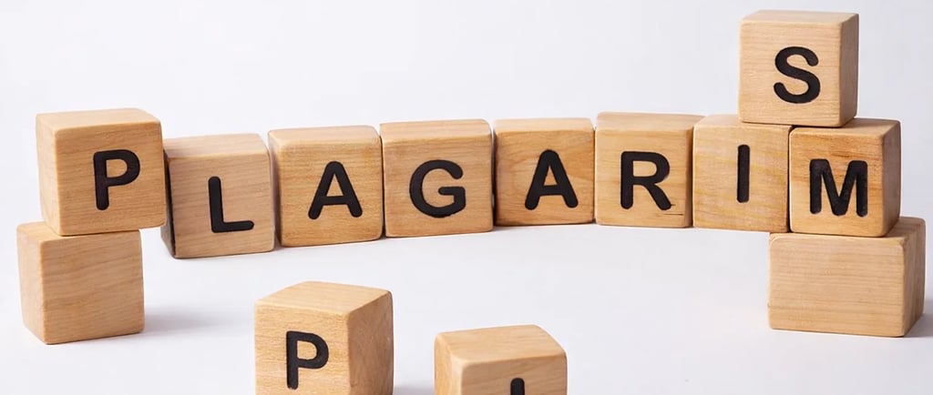 The word "PLAGIARISM" written with wooden blocks with letter left occasionally on table 