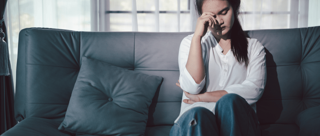 a woman sitting on a couch 