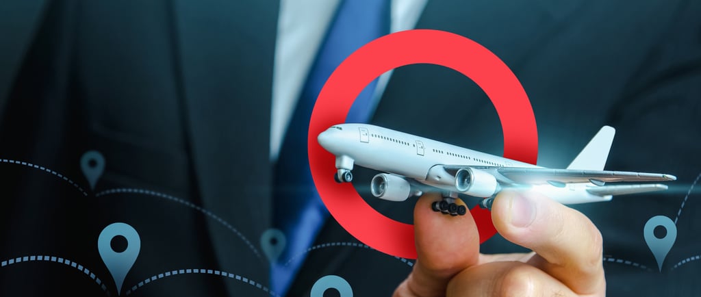 a man in a suit and tie flying an airoplane