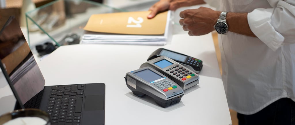 Person working with retailcore software at billing counter