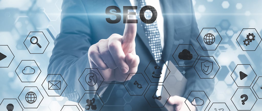 Business owner analyzing SEO reports on laptop for local search visibility