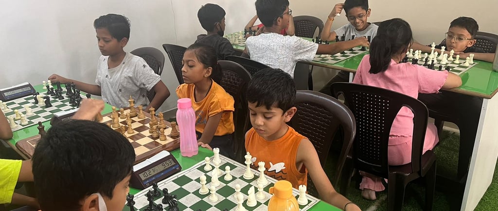Kids playing chess at White Knight Chess Academy