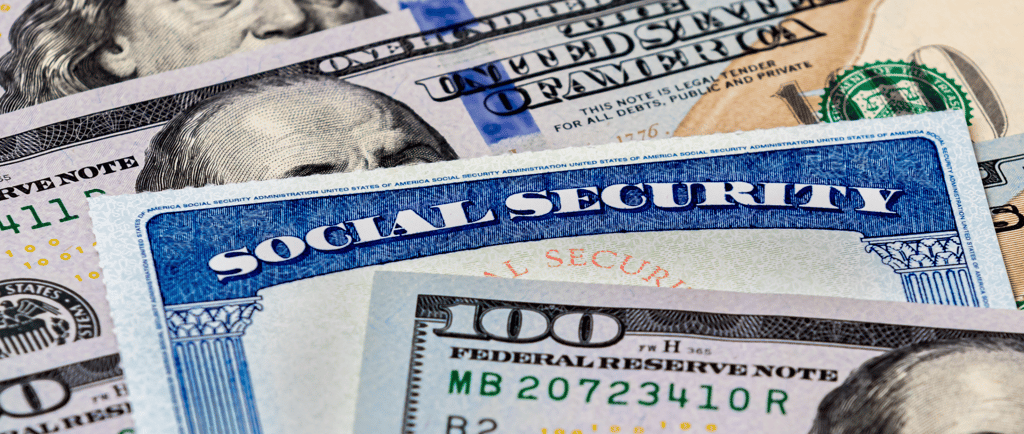 a hundred dollar bill and social security card for social security benefits