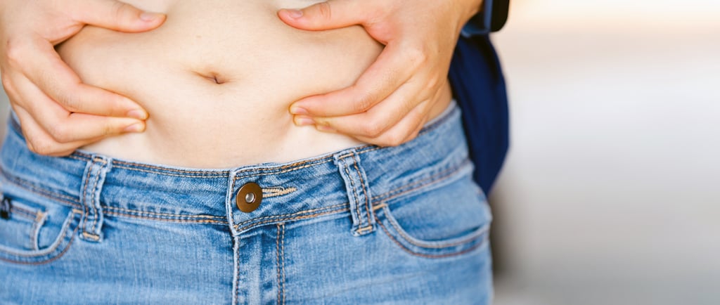 A person squeezing there stomach