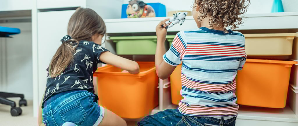 Boy & Girl with IKEA Trofast unit storing toys