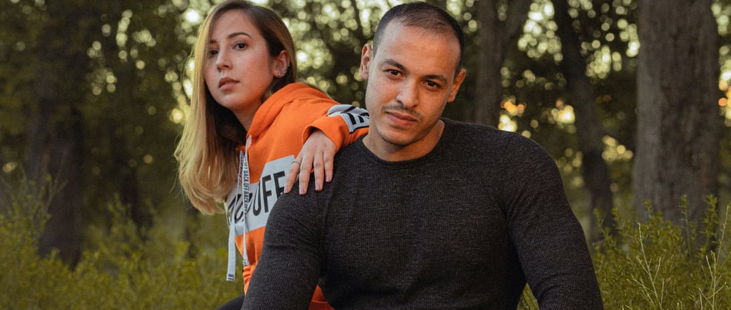 A man pulling away from his girlfriend