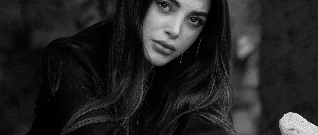 a beautiful woman looking and staring; asking herself "does he miss me?"