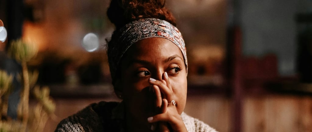 woman sitting and thoughtfully thinking about her relationship