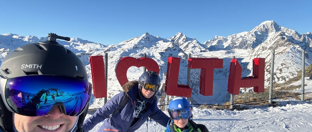 family at the I live la thuile sign in italy