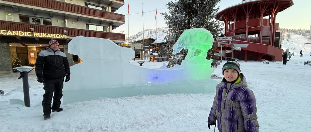 family in ruka finland by ice sign