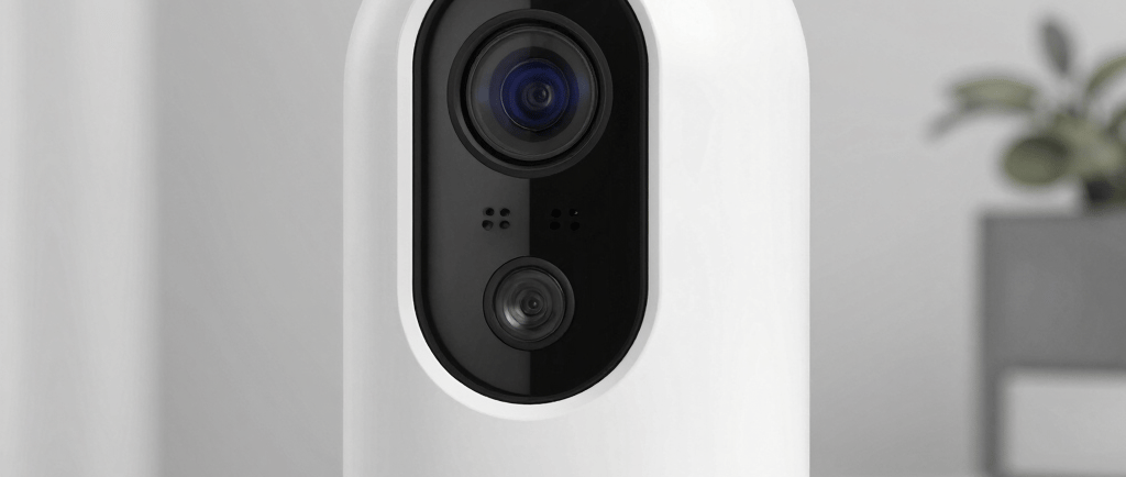 Close-up of an orange robot's face with blue eyes