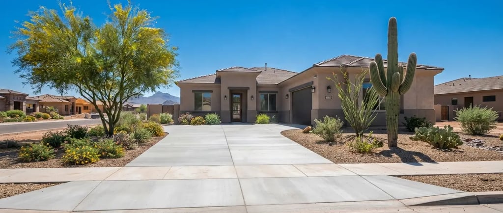 newly finished residential concrete driveway in a suburban Arizona neighborhood