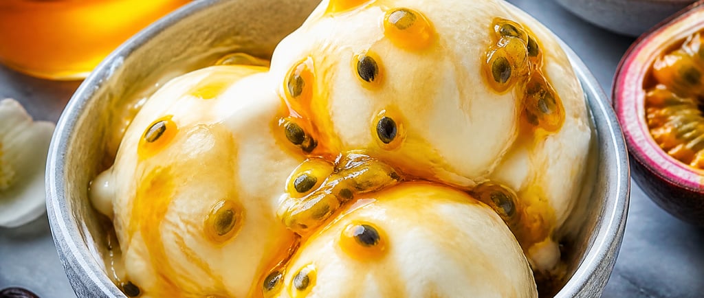 Scoops of vanilla bean ice cream topped with fresh passion fruit pulp and a honey drizzle.