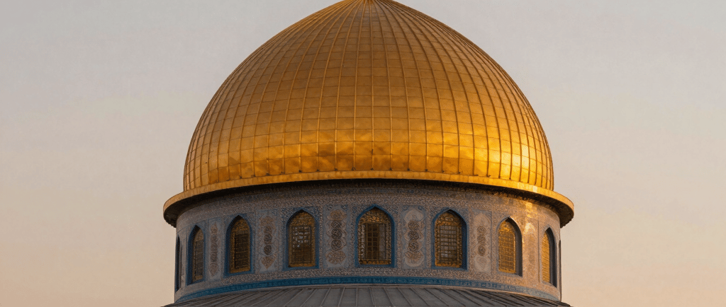 Islamic mosque with golden dome at sunset
