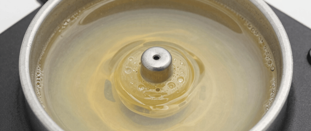 clear glass jar with brown liquid