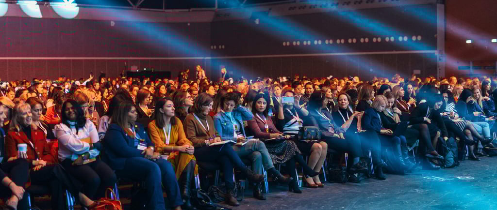 Large audience seated in a conference hall