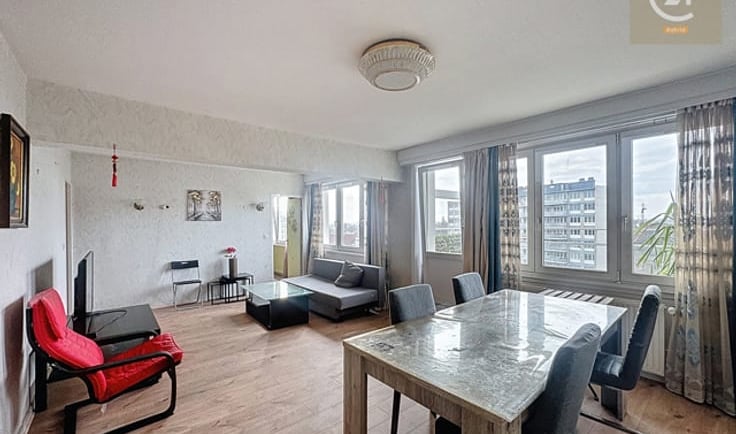 a dining room with a table and chairs