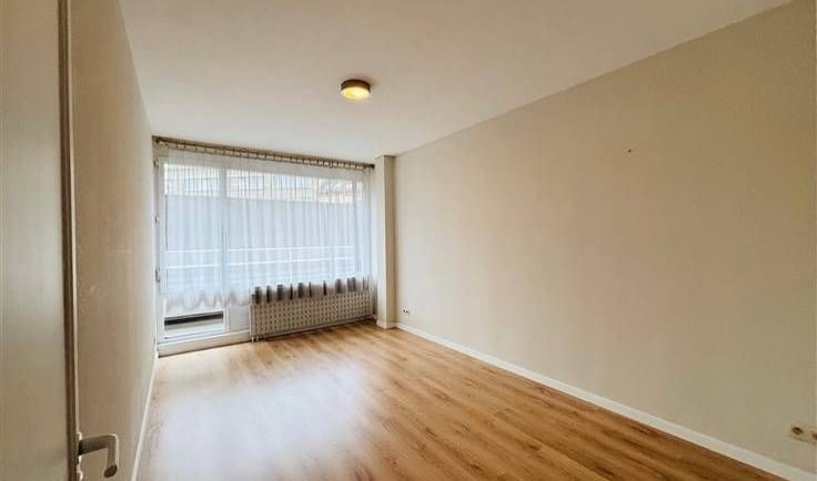 a room with a window and a window