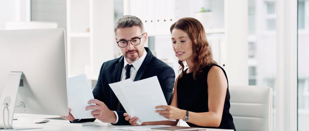 Inventor reviewing patent application documents marked Patent Pending