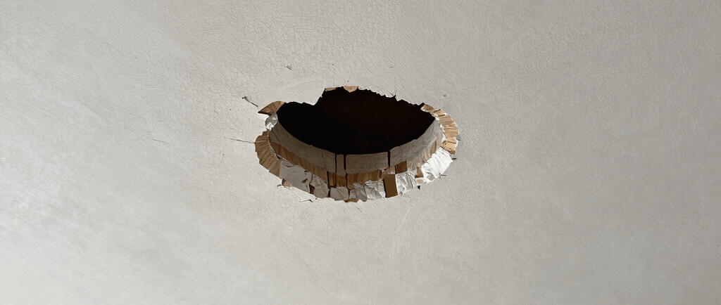 drywall ceiling with a hole