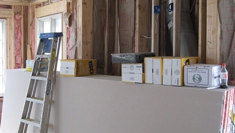 pile of sheetrock against the wall