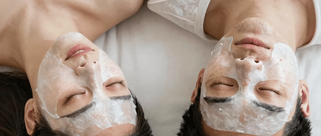 Hand pouring powder from packet into glass of water.