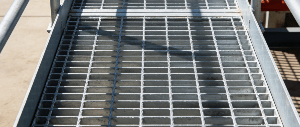 a metal grate with a metal grate and a metal grate