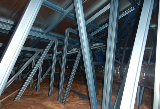 Roof maintenance occurring on Perth property with steel trusses. 