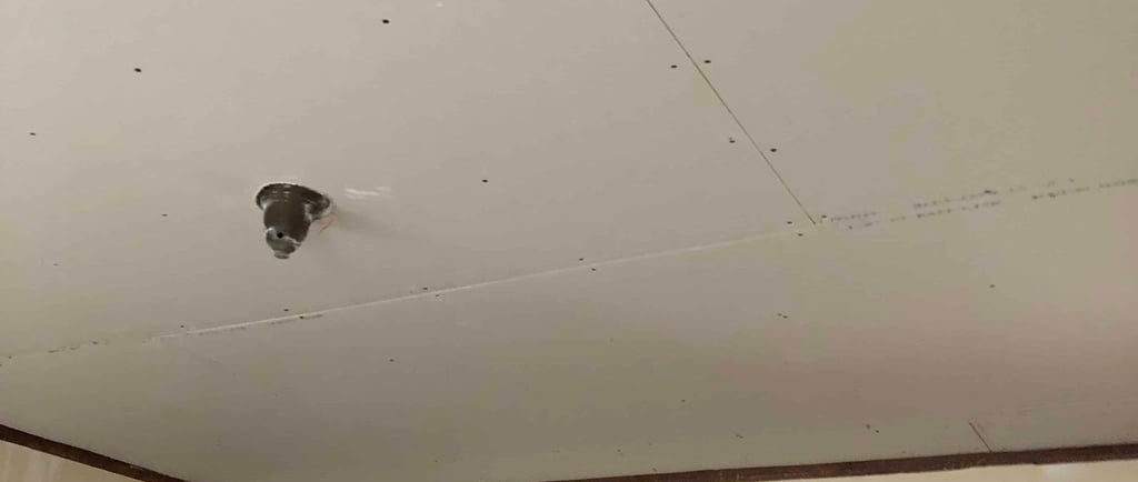 sheetrock ceiling installed over plaster