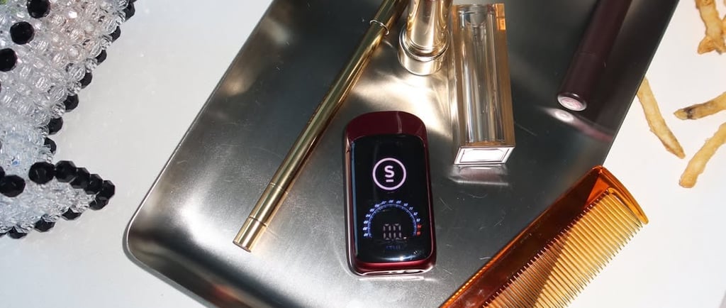 Select Briq 2 vape charging via USB-C cable with screen showing charge status