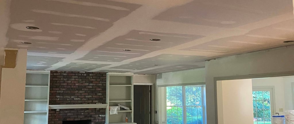 drywall installed by drywall contractor on the ceiling over popcorn
