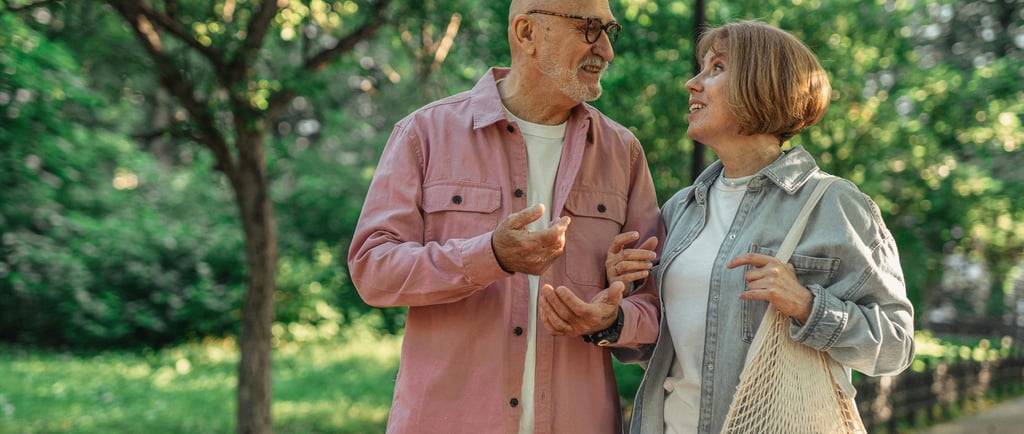 married couple walking home after grocery shopping