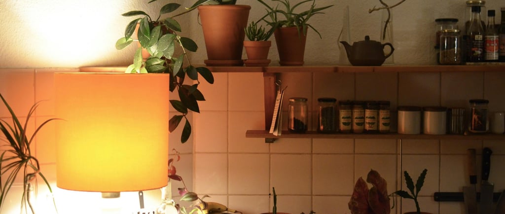 a kitchen with a lamp and a lamp on a counter