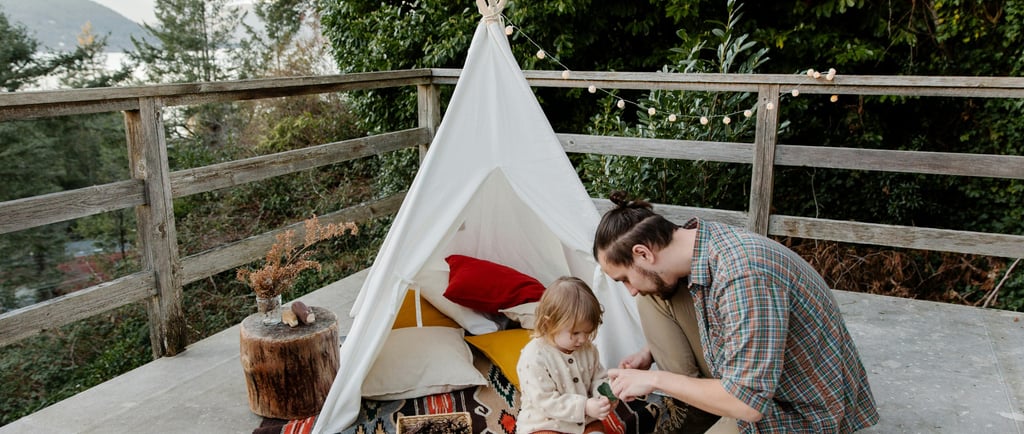 dad playing make believe house with his daughter