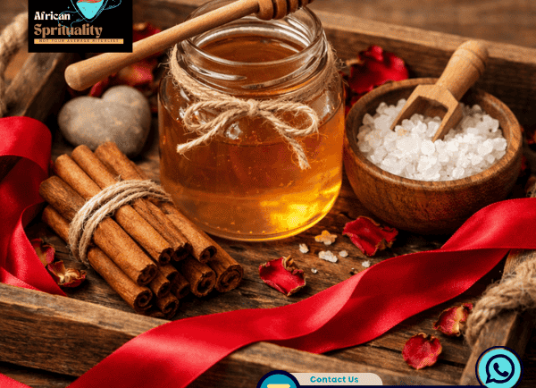 Natural honey jar with cinnamon sticks, sea salt, and red rose petals for spiritual rituals.