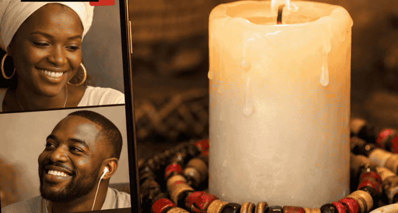 A glowing candle and African prayer beads next to a smartphone showing a spiritual video consultation.