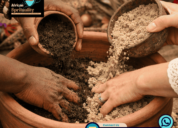 Traditional African spiritual healers mixing herbal earth powders in a clay ritual bowl.