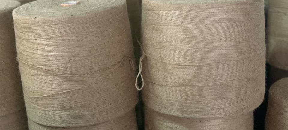Stacks of premium-grade jute yarn, crafted with precision and sustainability in mind. Perfect for ec