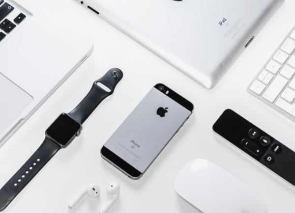 an apple  products on the table watch ,phone,i pods,etc