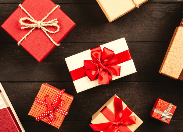 many gift boxes with ribbon on it