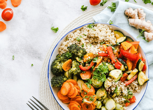  a vegetable bowl on table with fork