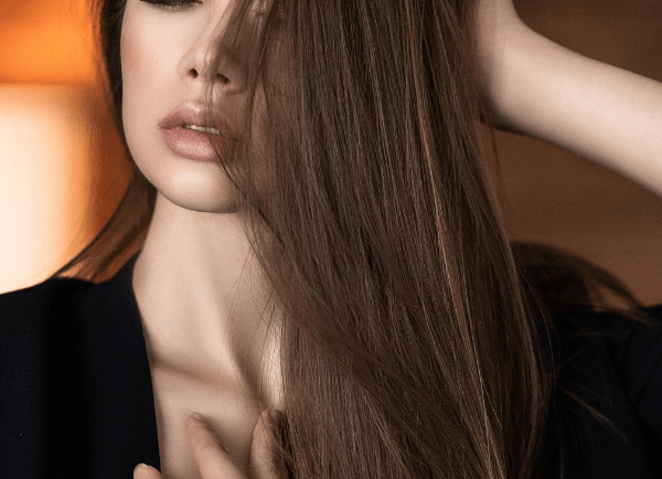 a girl with long hair standing