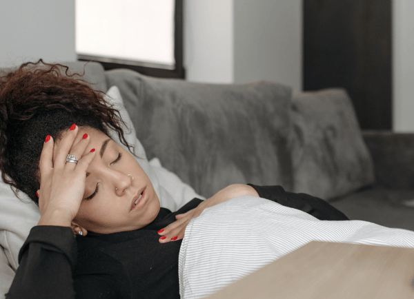 sick women lying on bed